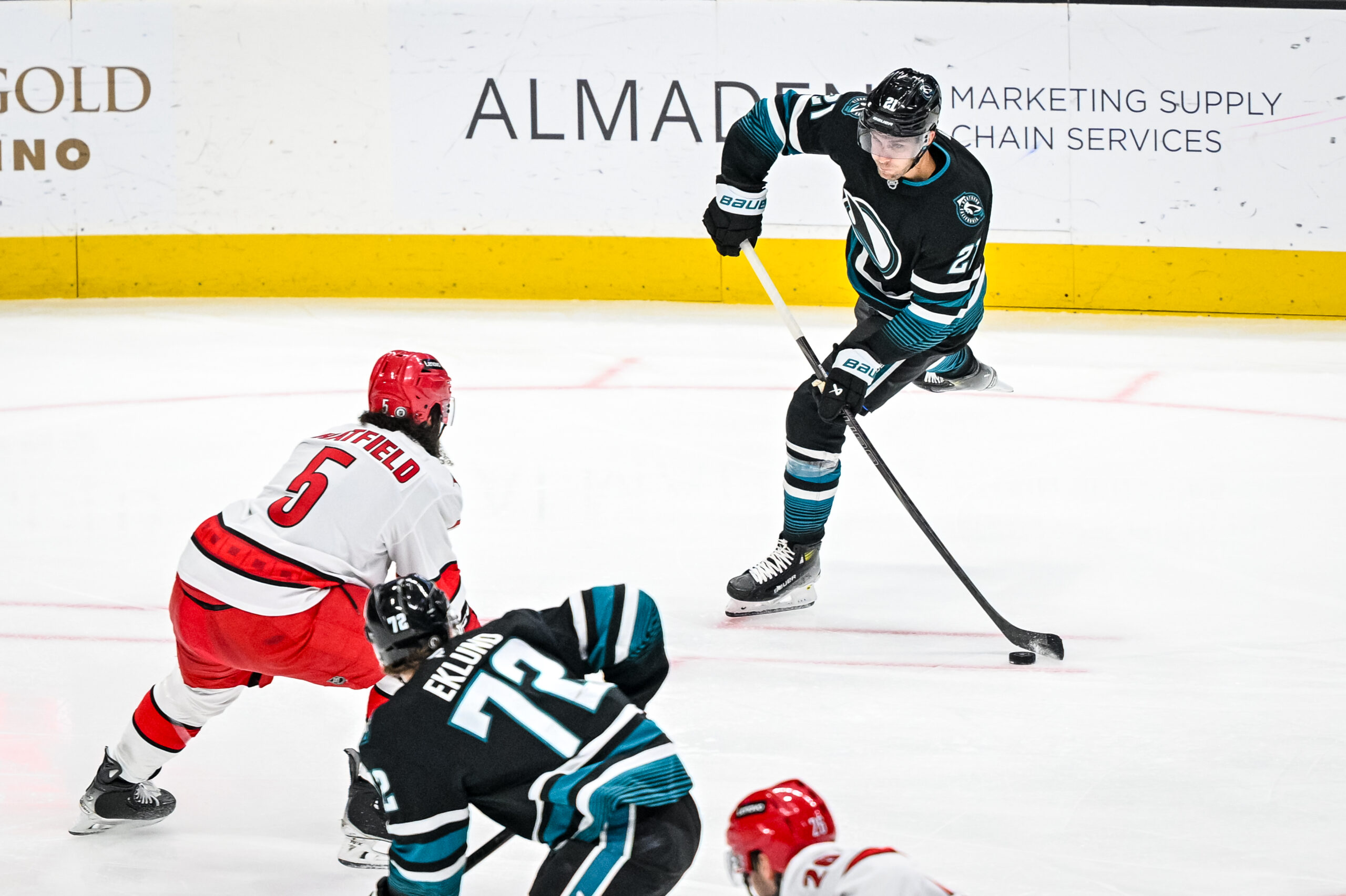 San Jose Sharks forward Alexander Wennberg shooting a puck