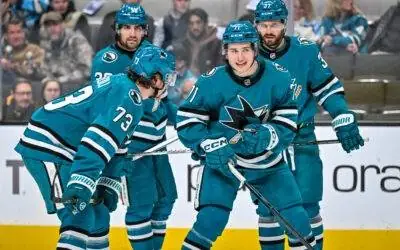 San Jose Sharks forward Macklin Celebrini talks to his teammates before a face-off.