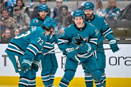 San Jose Sharks forward Macklin Celebrini talks to his teammates before a face-off.