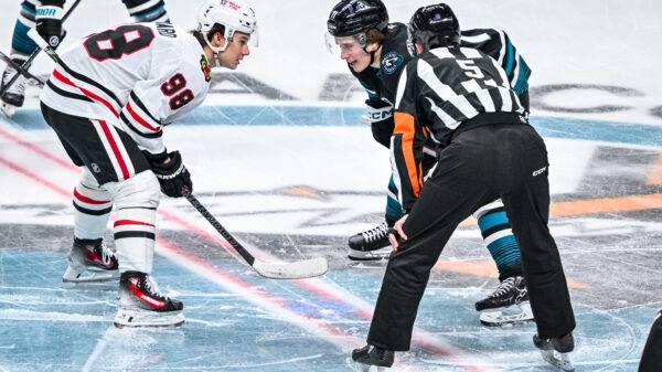 San Jose Sharks center Macklin Celebrini and Chicago Blackhawks center Connor Bedard take a face-off
