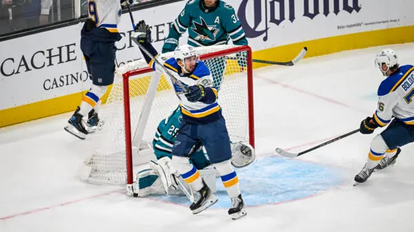 St. Louis Blues forward Jordan Kyrou scores a goal against the San Jose Sharks.