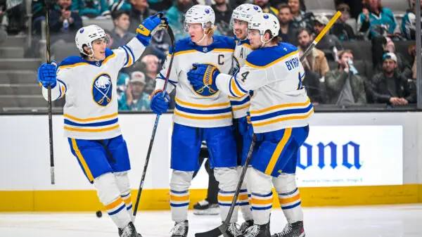 Bowen Byram and the Buffalo Sabres celebrate a goal against the San Jose Sharks.