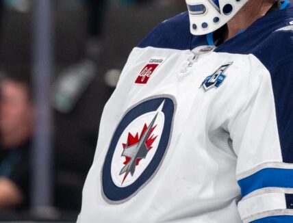 Winnipeg Jets logo against the San Jose Sharks